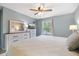 Comfortable bedroom with a dresser, television, and natural light at 3585 41St S Ter # 227, St Petersburg, FL 33711