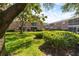 Exterior view of building with lush landscaping and blue skies overhead at 3585 41St S Ter # 227, St Petersburg, FL 33711