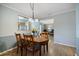 Cozy dining room with hardwood floors and view into living room at 3585 41St S Ter # 227, St Petersburg, FL 33711