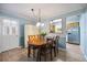 Cozy dining area with wood floors, table for four and a view to the kitchen at 3585 41St S Ter # 227, St Petersburg, FL 33711