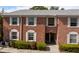 Charming two-story brick home featuring white shutters and lush landscaping at 3585 41St S Ter # 227, St Petersburg, FL 33711