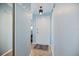Bright hallway with light blue walls, hardwood floors, and coat rack at 3585 41St S Ter # 227, St Petersburg, FL 33711