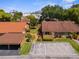 Aerial view featuring well-maintained homes, landscaping, and designated parking spaces in the community at 4022 Lighthouse Way, New Port Richey, FL 34652