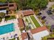 Overhead view of outdoor shuffleboard courts next to a refreshing community swimming pool at 4022 Lighthouse Way, New Port Richey, FL 34652