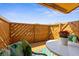 Relaxing patio space with a decorative privacy fence, outdoor seating and table, ideal for outdoor enjoyment at 4022 Lighthouse Way, New Port Richey, FL 34652