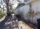 Exterior side view of the home showing the AC unit and electrical box at 4405 Coconut Cove Pl, Valrico, FL 33596