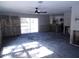 Open concept living room leading to kitchen with sliding glass door access to backyard at 4405 Coconut Cove Pl, Valrico, FL 33596