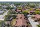 Aerial view of condo community featuring mature trees, sidewalks, landscaping, and multiple residential buildings at 4424 Pelorus Dr, New Port Richey, FL 34652