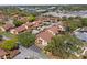 Aerial view of condo community featuring mature trees, sidewalks, landscaping, and multiple residential buildings at 4424 Pelorus Dr, New Port Richey, FL 34652