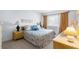 Inviting bedroom with a plush king-size bed, complemented by bedside tables and natural light from the windows at 4424 Pelorus Dr, New Port Richey, FL 34652