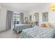 Inviting bedroom featuring two beds with picturesque views from the window, enhanced by soft natural light at 4424 Pelorus Dr, New Port Richey, FL 34652