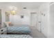 Comfortable bedroom featuring twin beds with soft patterned covers and a warm, inviting atmosphere at 4424 Pelorus Dr, New Port Richey, FL 34652
