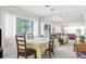 Bright dining room features a mirrored wall, enhancing the space, and a table set for a meal at 4424 Pelorus Dr, New Port Richey, FL 34652