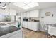 Bright kitchen featuring sleek white cabinetry and modern appliances, perfect for cooking and entertaining at 4424 Pelorus Dr, New Port Richey, FL 34652