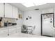 Efficient kitchen with white appliances, including a refrigerator, and cozy dining area at 4424 Pelorus Dr, New Port Richey, FL 34652