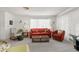 Cozy living room with neutral carpet, bright walls, and comfortable seating arrangement at 4424 Pelorus Dr, New Port Richey, FL 34652