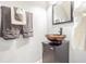 Chic bathroom with a unique vessel sink and cabinet, and decorative towels at 4603 Barnstead Dr, Riverview, FL 33578