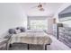 Bright bedroom with ceiling fan, large windows and comfortable decor at 4603 Barnstead Dr, Riverview, FL 33578