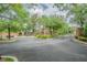 Community gate featuring brick pillars, manicured landscaping, and secure access at 4603 Barnstead Dr, Riverview, FL 33578