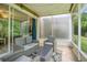 Relaxing screened patio with comfortable seating overlooking green yard at 4603 Barnstead Dr, Riverview, FL 33578