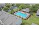 Community pool offering lounge chairs and a covered pavilion, set in lush greenery at 4603 Barnstead Dr, Riverview, FL 33578