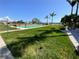 Community lawn bowling green near the water with palm trees and tropical landscaping at 5020 Brittany S Dr # 212, St Petersburg, FL 33715