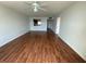 Bright, large living room with wood floors and a ceiling fan at 5020 Brittany S Dr # 212, St Petersburg, FL 33715