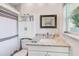 Updated bathroom with granite vanity, white cabinets, and modern fixtures at 533 Keene Rd, Largo, FL 33771