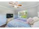 Inviting bedroom featuring warm light, hardwood floors, and calming decor at 533 Keene Rd, Largo, FL 33771