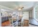Open-concept dining room with hardwood floors, comfortable seating, and seamless flow to living spaces at 533 Keene Rd, Largo, FL 33771