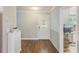 Inviting foyer showcasing hardwood floors and a decorative glass front door at 533 Keene Rd, Largo, FL 33771