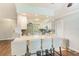 Modern kitchen featuring a breakfast bar with seating and granite countertops at 533 Keene Rd, Largo, FL 33771
