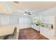 Bright kitchen featuring white cabinets, granite countertops, and modern appliances at 533 Keene Rd, Largo, FL 33771