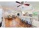 Open-concept living room and kitchen with hardwood floors and recessed lighting at 533 Keene Rd, Largo, FL 33771