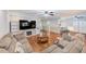 Open living room featuring a fireplace, built-in shelves, and a breakfast bar at 533 Keene Rd, Largo, FL 33771