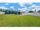 Spacious backyard with well-maintained lawn, a concrete patio, a screened-in patio, and a privacy fence at 5367 5Th N Ave, St Petersburg, FL 33710