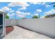 A view of the home's backyard featuring a new, tall, white privacy fence and a concrete walkway at 5367 5Th N Ave, St Petersburg, FL 33710
