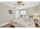 Comfortable bedroom with wood floors, ceiling fan, and window at 5367 5Th N Ave, St Petersburg, FL 33710