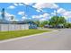 Charming home with a well-maintained lawn, freshly-painted siding, and a tall privacy fence at 5367 5Th N Ave, St Petersburg, FL 33710