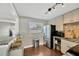 Bright kitchen with stainless steel refrigerator, granite counters, and wood floors at 5367 5Th N Ave, St Petersburg, FL 33710