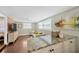 Bright living room with hardwood floors and granite breakfast bar counter overlooking a stylish living room at 5367 5Th N Ave, St Petersburg, FL 33710