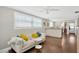 Bright living room featuring hardwood floors, a modern couch, and lots of natural light at 5367 5Th N Ave, St Petersburg, FL 33710