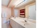 Bathroom featuring double sinks, a large mirror with vanity lighting, and a tiled floor at 6021 Bahia Del Mar Cir # 534, St Petersburg, FL 33715