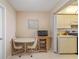 Cozy kitchen nook with a small table, microwave and access to kitchen area at 6021 Bahia Del Mar Cir # 534, St Petersburg, FL 33715