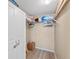 Bright, organized walk-in closet with shelving, hanging racks, and neutral-toned walls at 6021 Bahia Del Mar Cir # 534, St Petersburg, FL 33715