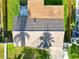 An aerial view of the home showing the roof, backyard, and nearby landscaping on a sunny day at 715 Charlotte Ave, Tarpon Springs, FL 34689