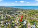 An aerial view of the home pointing toward the Gulf showing nearby communities and neighborhoods at 715 Charlotte Ave, Tarpon Springs, FL 34689