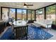 Sunroom with floor to ceiling windows and furniture to relax and enjoy the weather indoors at 715 Charlotte Ave, Tarpon Springs, FL 34689
