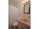 Cozy bathroom featuring a retro pink sink and matching tile details at 721 75Th N Ave, St Petersburg, FL 33702
