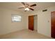 Bedroom with a ceiling fan, window, and closet at 721 75Th N Ave, St Petersburg, FL 33702